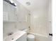 A bathroom featuring a tub-shower combo, along with vanity and updated lighting at 1877 Courtland Blvd, Deltona, FL 32738