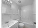 This is a bright bathroom with a tub-shower combo and a vanity sink with a square mirror at 1877 Courtland Blvd, Deltona, FL 32738