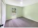 A carpeted bedroom with a window and closet, offering a cozy and private space at 1877 Courtland Blvd, Deltona, FL 32738