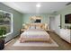 This is a furnished bedroom featuring a bed, nightstands, dresser, and window for natural light at 1877 Courtland Blvd, Deltona, FL 32738