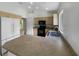 The kitchen offers tan cabinetry, black appliances, and a peninsula island with a double sink at 1877 Courtland Blvd, Deltona, FL 32738