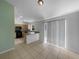 Open-concept kitchen with breakfast bar, tile floors, and natural light at 1877 Courtland Blvd, Deltona, FL 32738