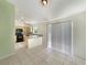 An open-concept kitchen featuring black appliances and ample counter space at 1877 Courtland Blvd, Deltona, FL 32738