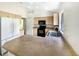 Bright kitchen featuring light wood cabinets, black appliances, and a convenient breakfast bar at 1877 Courtland Blvd, Deltona, FL 32738