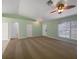 Bright living room with neutral carpet, ceiling fan, and a large window offering natural light at 1877 Courtland Blvd, Deltona, FL 32738