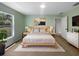 Staged main bedroom with modern decor and ample natural light at 1877 Courtland Blvd, Deltona, FL 32738