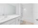 Bathroom featuring combination shower and tub and large sink with vanity at 200 Garnet Ave, Kissimmee, FL 34758