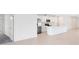 Open-concept kitchen with stainless steel appliances and modern finishes at 200 Garnet Ave, Kissimmee, FL 34758