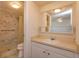 Well-lit bathroom with tiled shower and updated vanity at 200 Saint Andrews Blvd # 2607, Winter Park, FL 32792