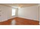 This bedroom features wood floors, a ceiling fan, and natural light at 200 Saint Andrews Blvd # 2607, Winter Park, FL 32792