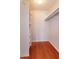 Walk-in closet with built-in shelving and wood-look flooring at 200 Saint Andrews Blvd # 2607, Winter Park, FL 32792