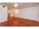 Spacious living room boasts wood floors and a ceiling fan and updated lighting at 200 Saint Andrews Blvd # 2607, Winter Park, FL 32792