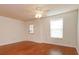 Bright living room features wood floors, ceiling fan, and access to the exterior at 200 Saint Andrews Blvd # 2607, Winter Park, FL 32792