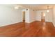 Open concept living area boasts wood floors, a ceiling fan, and access to other rooms at 200 Saint Andrews Blvd # 2607, Winter Park, FL 32792