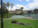 Enjoy outdoor shuffleboard courts with tropical palm trees and well-maintained landscaping at this beautiful community at 200 Saint Andrews Blvd # 2607, Winter Park, FL 32792