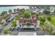 Community aerial view showcasing parking, landscaping, and proximity to a beautiful lake at 240 Killarney Bay Ct # 4, Winter Park, FL 32789