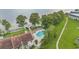 Aerial view of a community pool near the lake and a beautiful lawn and a walking path at 240 Killarney Bay Ct # 4, Winter Park, FL 32789