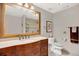 Traditional bathroom with wood vanity, marble countertop, and tiled shower at 240 Killarney Bay Ct # 4, Winter Park, FL 32789