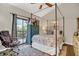 Cozy bedroom with canopy bed, office chair, and natural light at 240 Killarney Bay Ct # 4, Winter Park, FL 32789