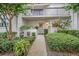 Charming home exterior featuring a quaint front entrance and a lovely balcony above the front door at 240 Killarney Bay Ct # 4, Winter Park, FL 32789