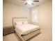 Neat bedroom with a ceiling fan, bright window, and carpeted floor at 2612 Summer Clouds Way, Kissimmee, FL 34744