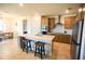 Kitchen featuring a spacious island with seating, stainless steel appliances, and ample cabinet space at 2612 Summer Clouds Way, Kissimmee, FL 34744