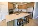Well-equipped kitchen with a large island, stainless steel appliances, and plenty of cabinet storage at 2612 Summer Clouds Way, Kissimmee, FL 34744