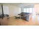 Inviting living room with a sectional sofa, shutters, and sliding glass doors to the patio at 2612 Summer Clouds Way, Kissimmee, FL 34744