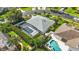 Aerial shot showcasing the home, screened-in pool, and landscaped yard within a well-maintained neighborhood at 2865 Ashton Ter, Oviedo, FL 32765