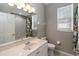 Bathroom featuring a vanity, a window, and a shower-tub combo with a neutral colored wall at 2865 Ashton Ter, Oviedo, FL 32765