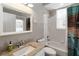 Bright bathroom featuring a tub, white tiled walls, granite countertops, and a modern sink with a window view at 2865 Ashton Ter, Oviedo, FL 32765