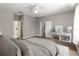 Staged bedroom with neutral paint, wood floors, ceiling fan, and furnishings at 2865 Ashton Ter, Oviedo, FL 32765