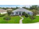 Charming single-story home with a well-manicured lawn and inviting walkway at 2865 Ashton Ter, Oviedo, FL 32765