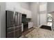 Updated kitchen with stainless steel appliances, granite counters, and tile backsplash at 2865 Ashton Ter, Oviedo, FL 32765