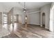 Spacious living area with arched doorways, wood floors and view to the entry at 2865 Ashton Ter, Oviedo, FL 32765