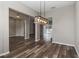 Open concept living space with wood flooring and modern lighting fixtures at 2865 Ashton Ter, Oviedo, FL 32765
