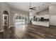 Open floor plan featuring a spacious living room, kitchen, and access to the pool at 2865 Ashton Ter, Oviedo, FL 32765