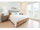 Bedroom with tiled floors, a decorative headboard, and access to a patio at 3004 Latitude Ln, Kissimmee, FL 34747