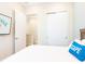 Bedroom features a television, closet and doorway to other rooms in the home at 3004 Latitude Ln, Kissimmee, FL 34747