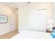 Bedroom showing closet, doorway to other rooms and a side table with a lamp at 3004 Latitude Ln, Kissimmee, FL 34747