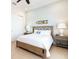Bedroom features side tables with lamps and tiled flooring in a neutral tone at 3004 Latitude Ln, Kissimmee, FL 34747