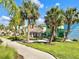 Pathways wind through the community's tropical landscaping, linking colorful Margaritaville homes at 3004 Latitude Ln, Kissimmee, FL 34747