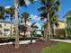 Picturesque community featuring vibrant homes, tropical palm trees, and inviting common areas at 3004 Latitude Ln, Kissimmee, FL 34747