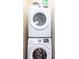 Efficient laundry area featuring stacked washer and dryer units, maximizing space at 3004 Latitude Ln, Kissimmee, FL 34747