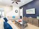 Bright living room with comfortable sofas, modern decor, and accent wall at 3004 Latitude Ln, Kissimmee, FL 34747