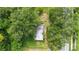 Aerial view of the house and property with surrounding mature trees and street access on the edge of the property at 321 Beard Rd, Winter Garden, FL 34787