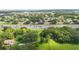 Aerial view showcasing the proximity of the property to the highway, nearby lake, and surrounding landscape at 321 Beard Rd, Winter Garden, FL 34787