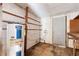 A basement interior with a water heater, exterior door, and built-in shelves at 321 Beard Rd, Winter Garden, FL 34787