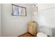 Compact bathroom features toilet, window and small vanity sink perfect for a quick refresh at 321 Beard Rd, Winter Garden, FL 34787