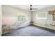 Bedroom featuring two windows allowing natural light with room for a cozy and personalized touch at 321 Beard Rd, Winter Garden, FL 34787